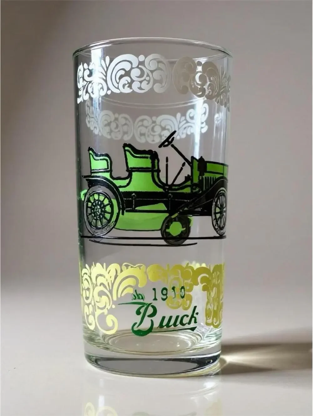 Vintage glass tumblers with early automobile designs 3